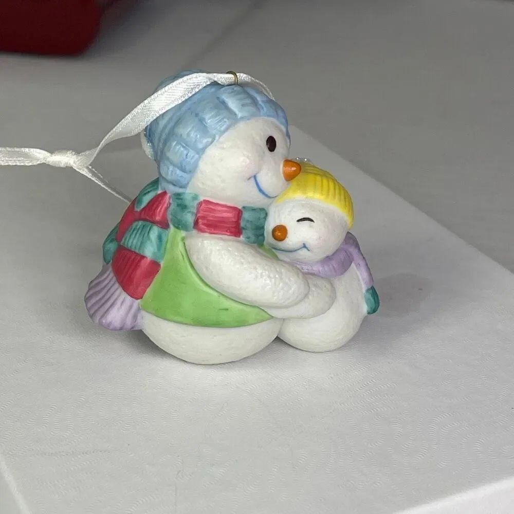 Vintage 2000 Hallmark keepsake “Warm Kisses” by Tammy Haddix.